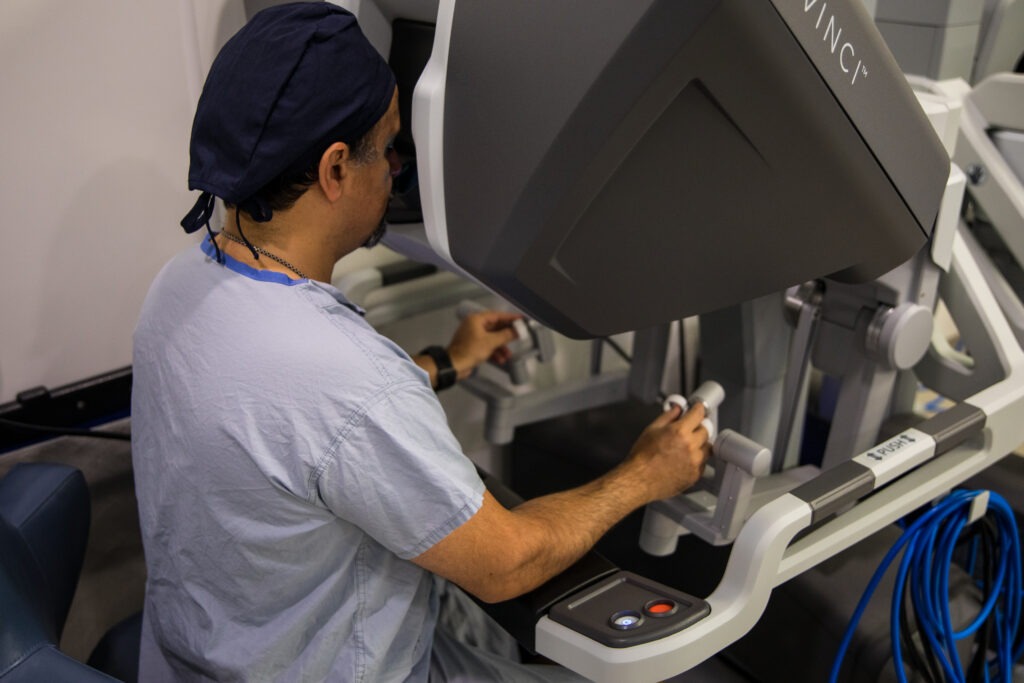 Dr. Bobby Shayegan, Chief of Surgery at St. Joe’s, using the da Vinci Xi surgical robot