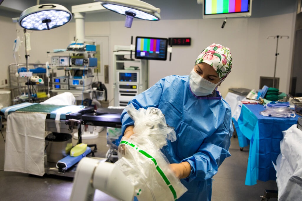 Nurse standing in forefront of the operating room